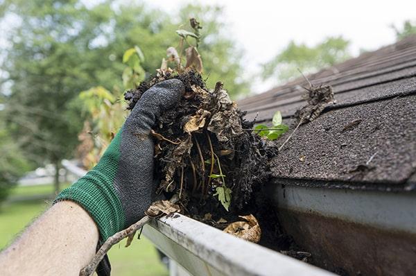 we use a combination of hand scooping and pressure washing for effective gutter cleaning